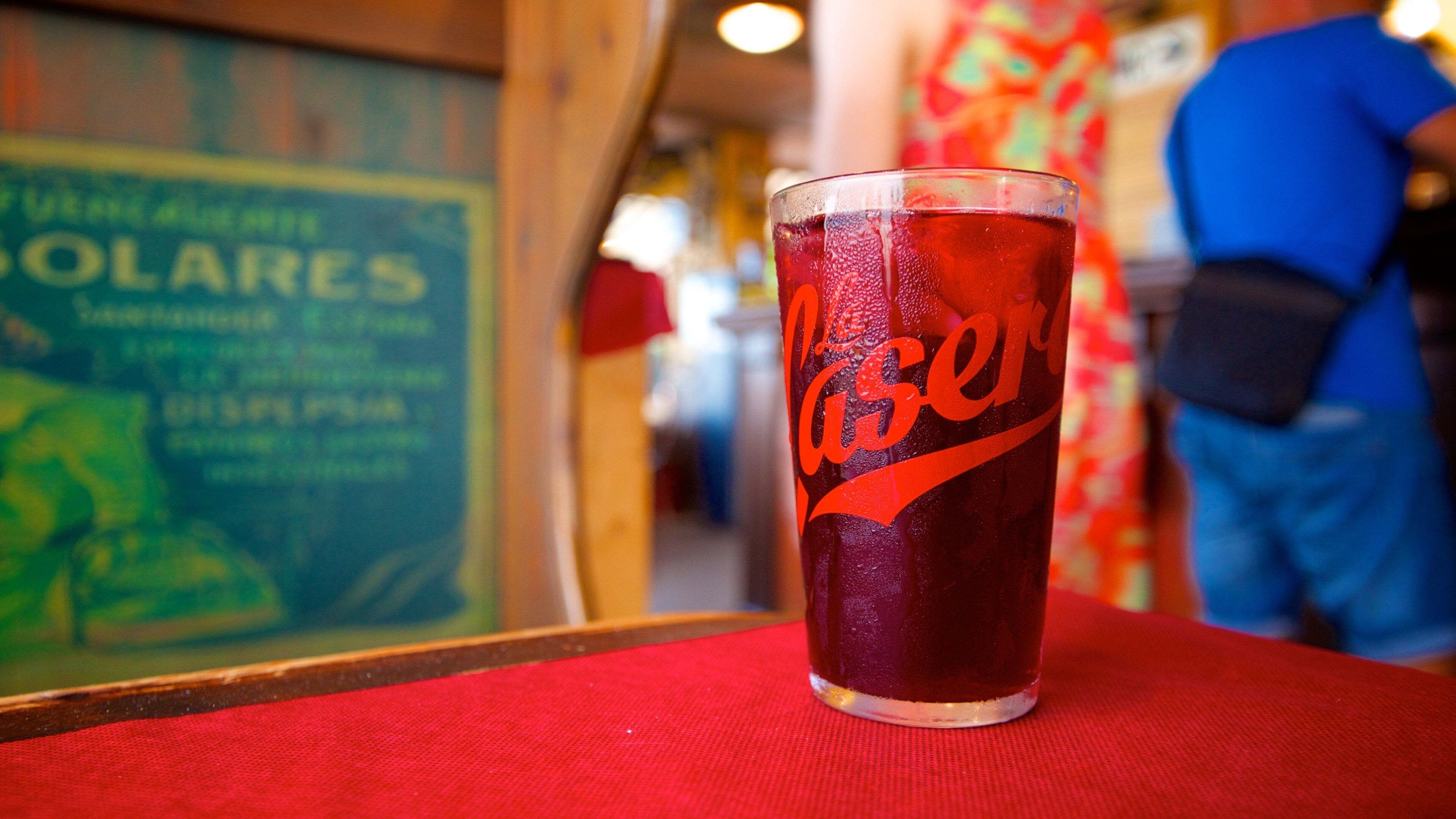 Malvarrosa Beach which includes drinks or beverages, a beach bar and a bar