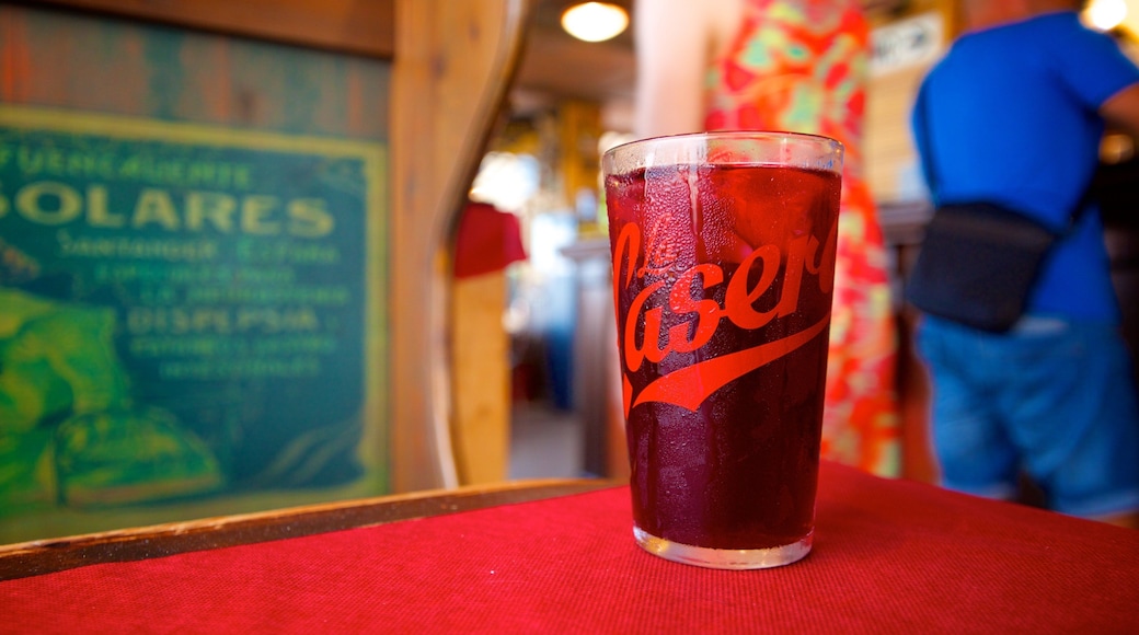 Malvarrosa Beach which includes drinks or beverages, a beach bar and a bar