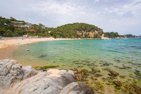 Santa Cristina Beach which includes a sandy beach and general coastal views
