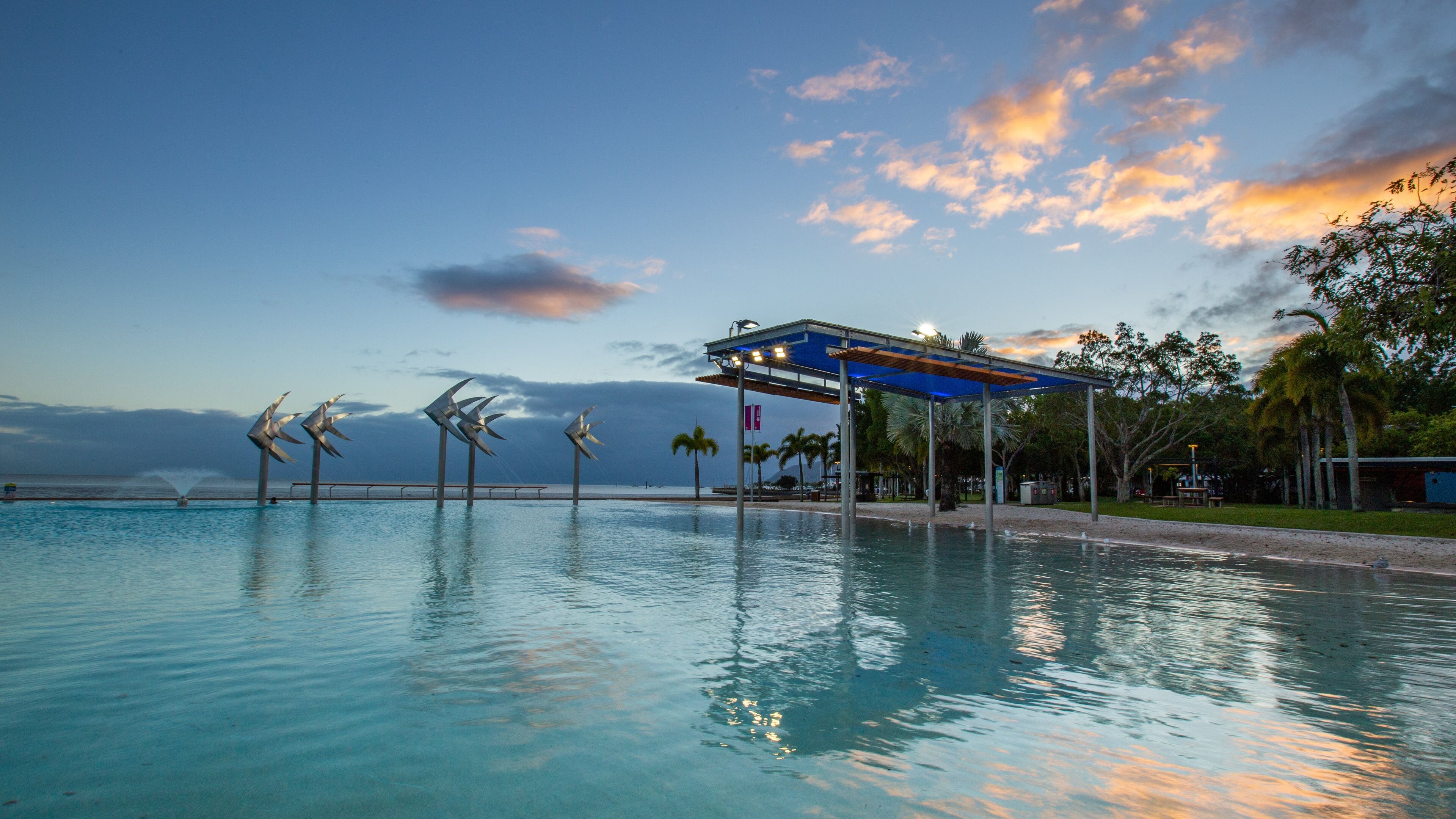 Esplanade Lagoon which includes a pool and a sunset