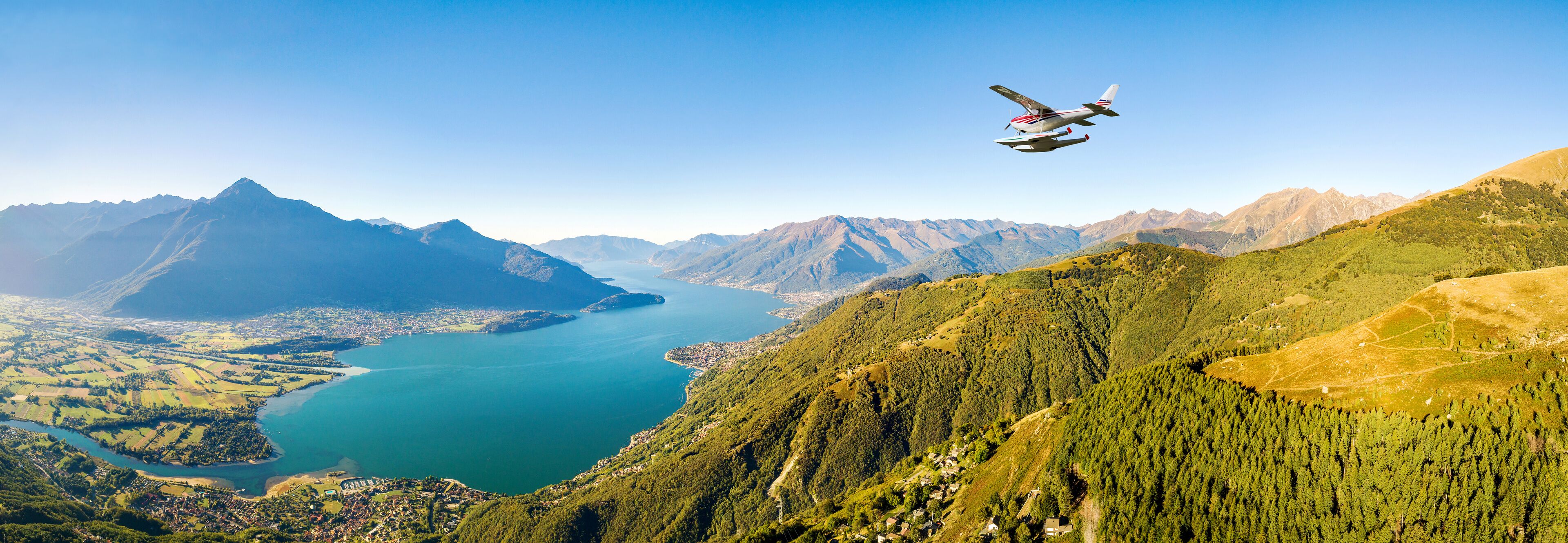 seaplane in flight over Lake Como, Italy