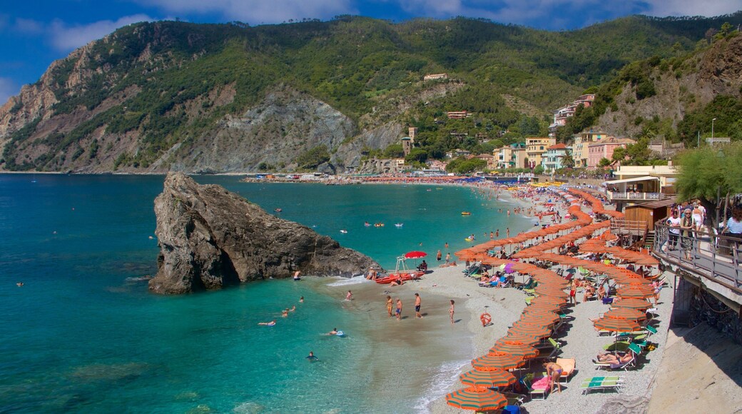 Monterosso Beach which includes a sandy beach, a luxury hotel or resort and swimming