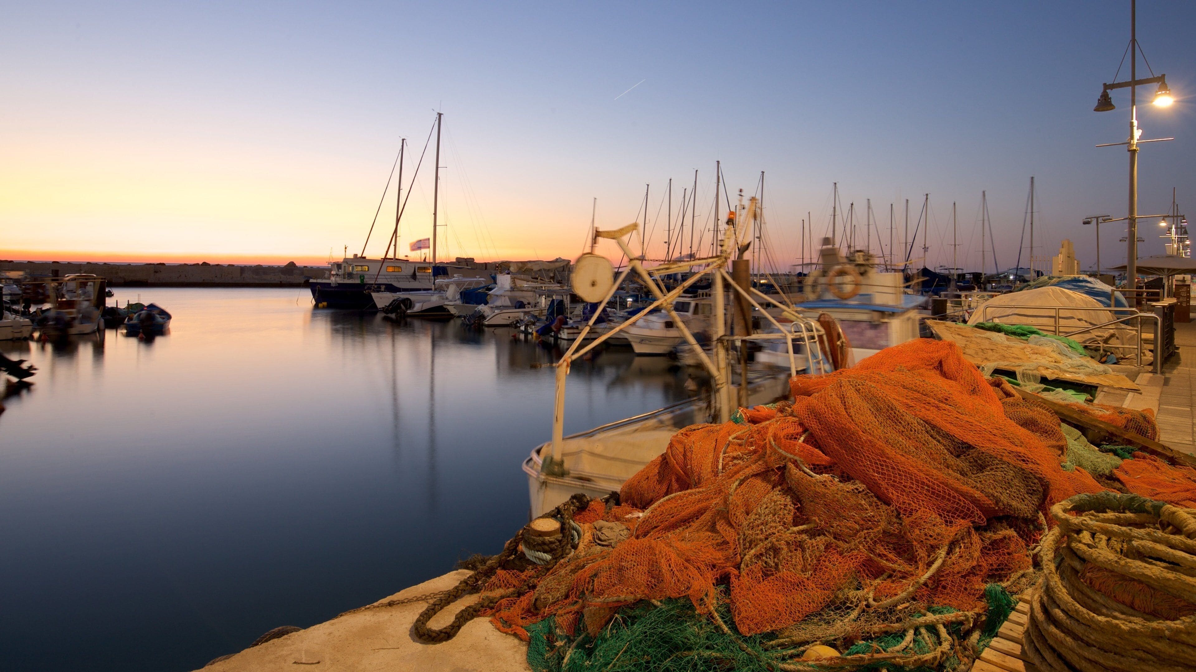 Jaffa Port featuring a bay or harbor and a sunset