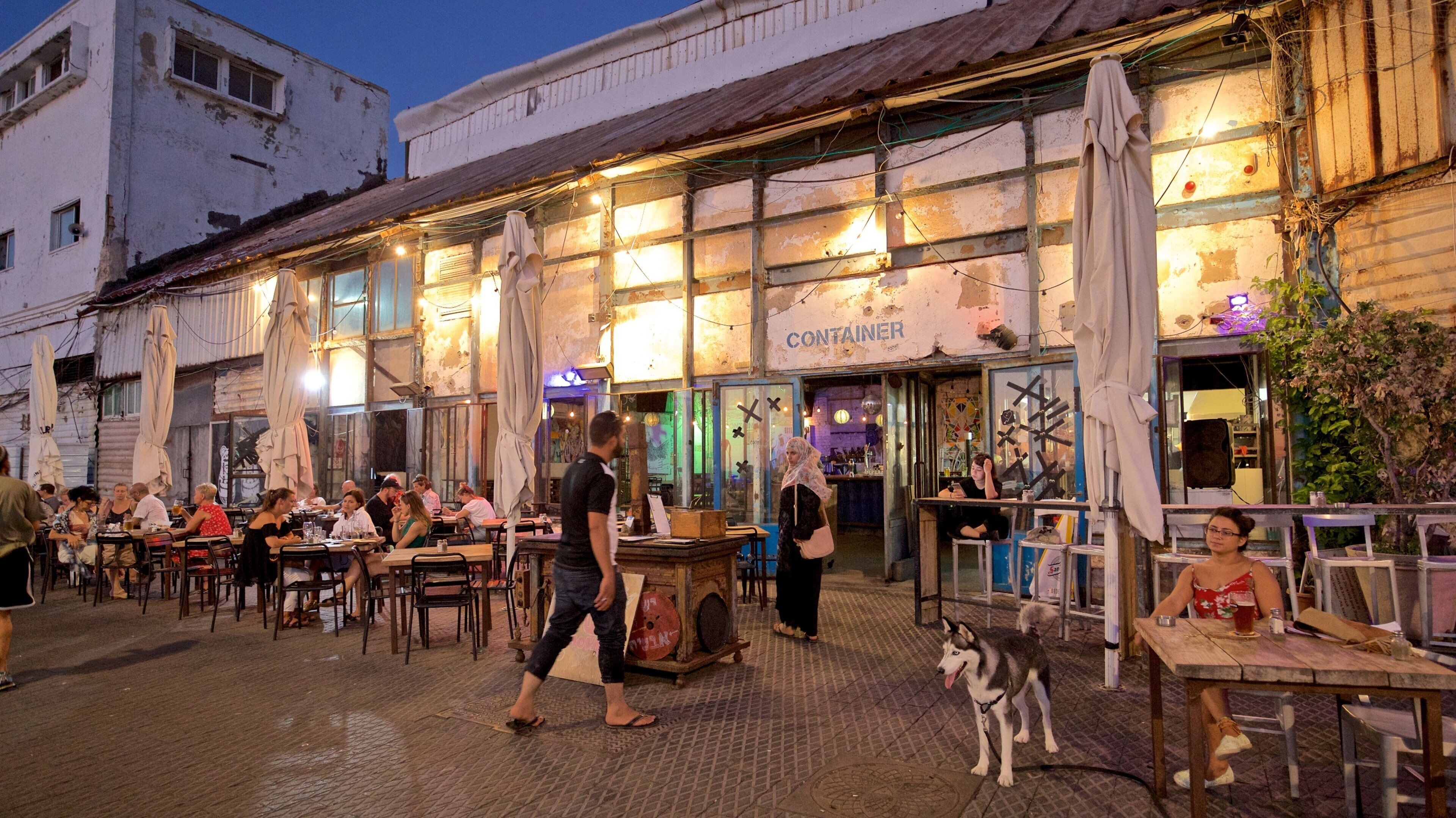 Jaffa Port featuring outdoor eating and night scenes as well as a small group of people