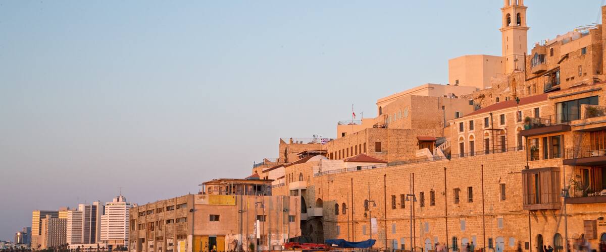 Jaffa Port showing a river or creek, a sunset and a city