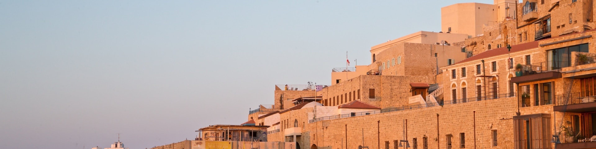 Jaffa Port showing a river or creek, a sunset and a city