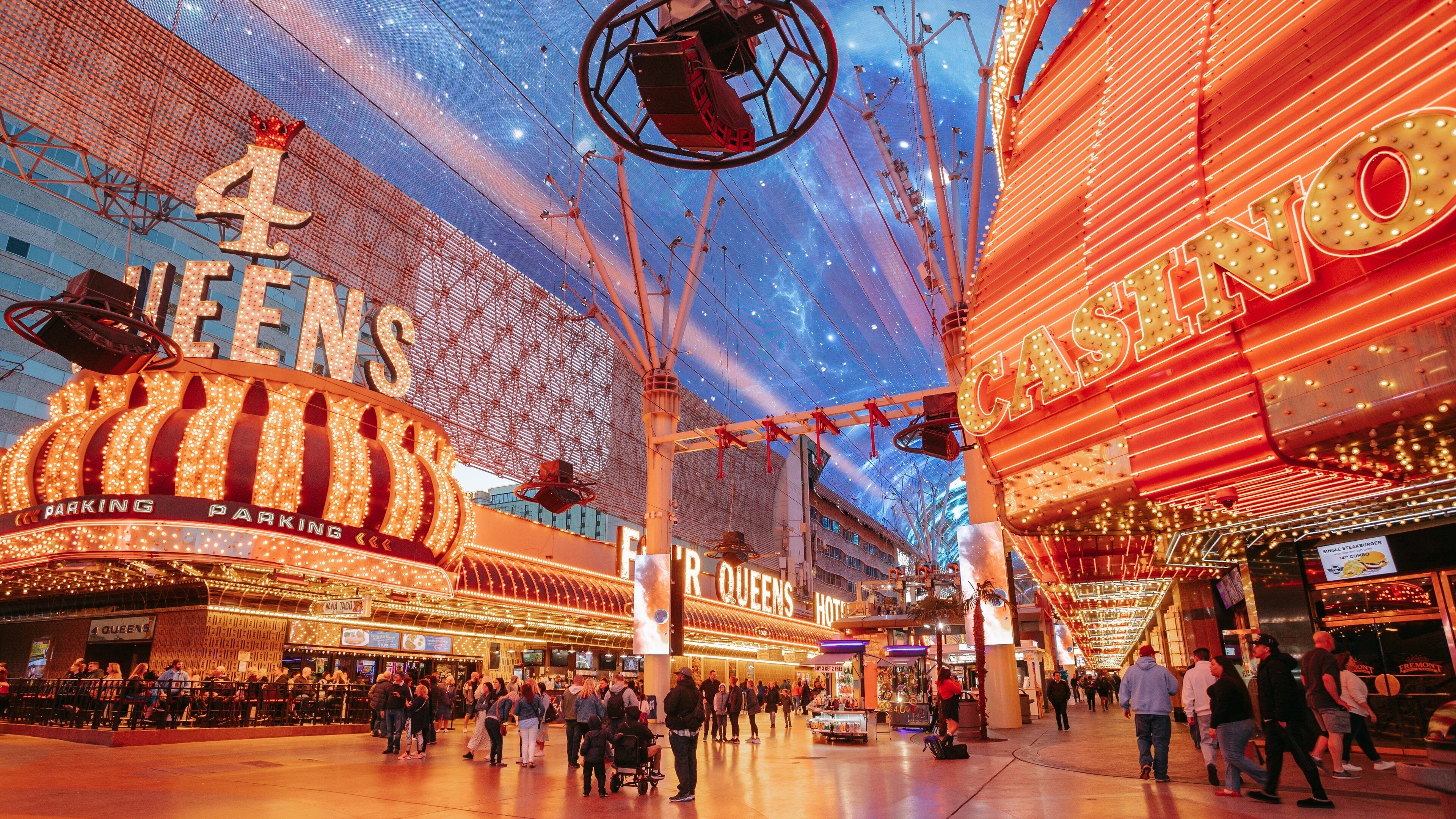 Fremont Street Experience which includes night scenes, signage and street scenes