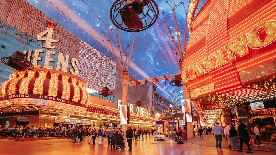 Fremont Street Experience which includes night scenes, signage and street scenes