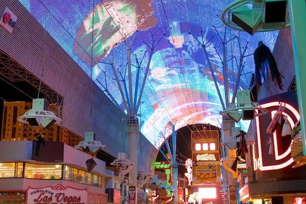 Fremont Street Experience showing night scenes, signage and outdoor art