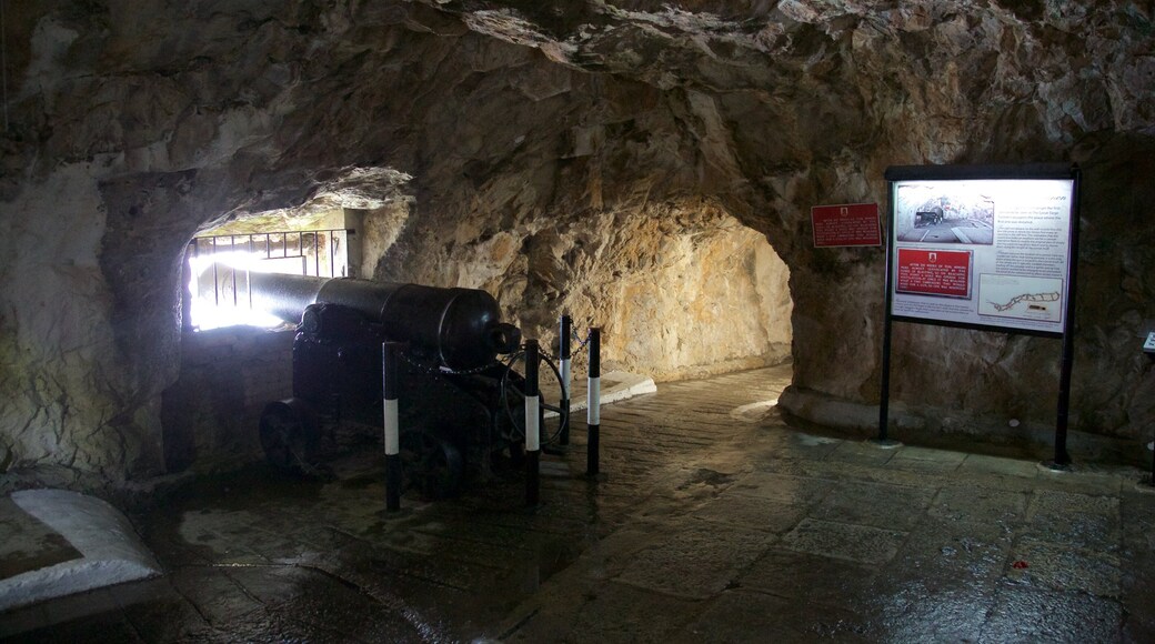 Military Heritage Centre and Great Siege Tunnels featuring signage, caving and military items