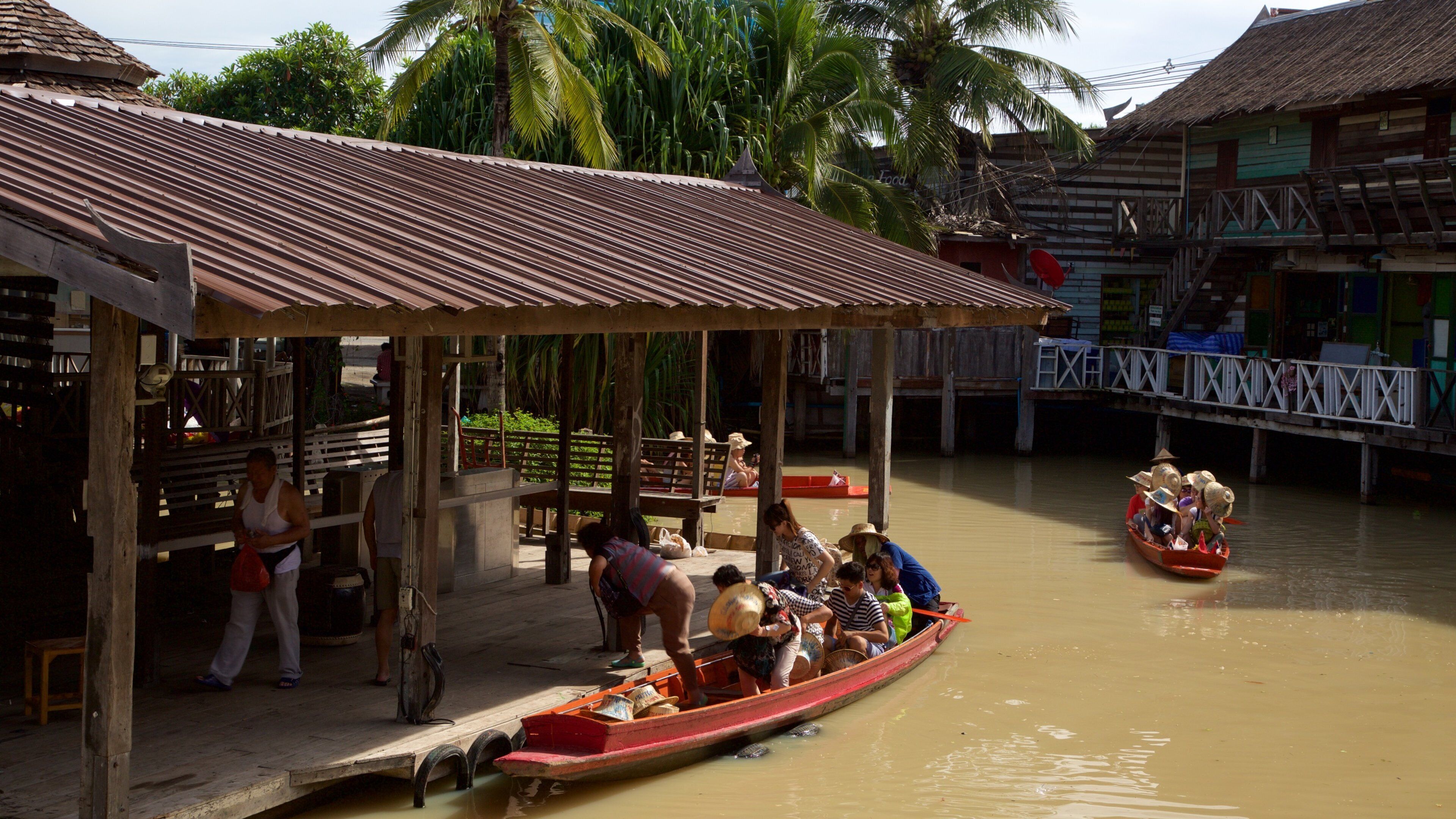 Pattaya Floating Market showing a river or creek and boating as well as a large group of people