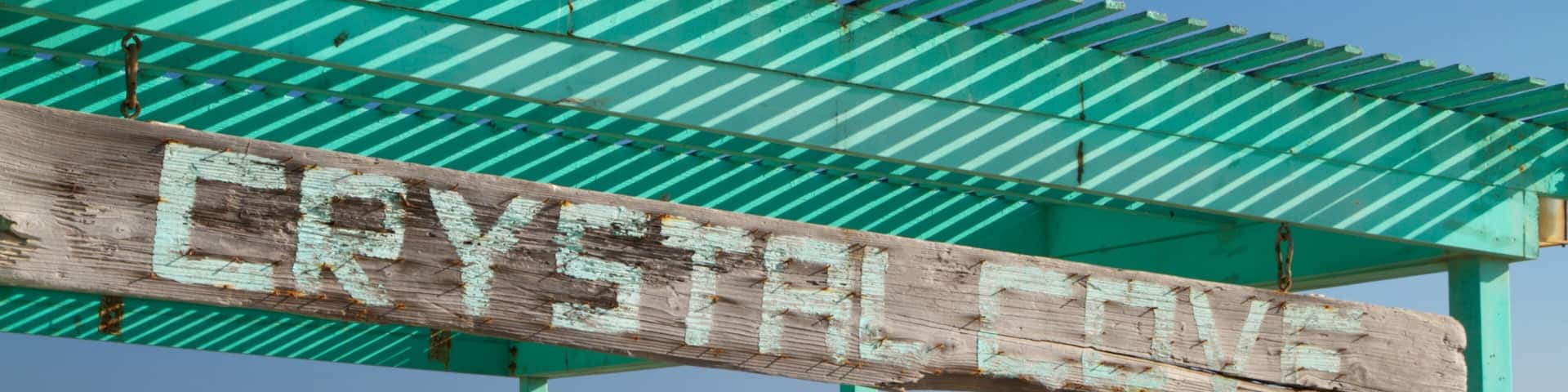 Crystal Cove State Park showing a beach, signage and landscape views