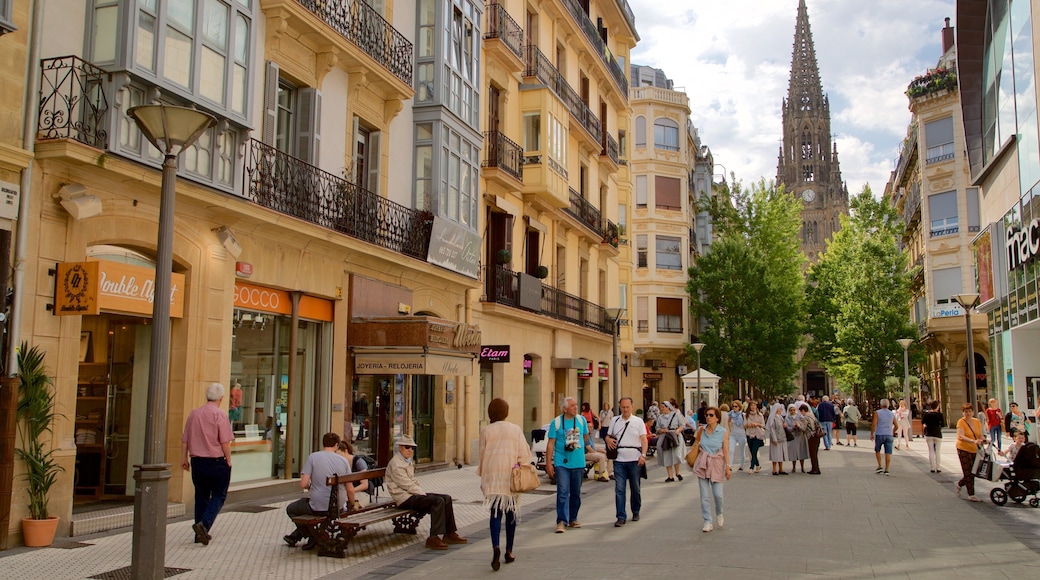 Cathedral of the Good Shepherd featuring heritage elements and street scenes as well as a large group of people
