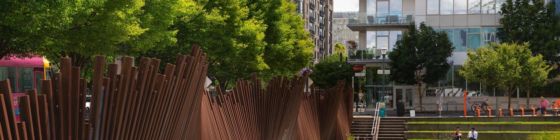 Pearl District showing a pond and a garden as well as an individual femail