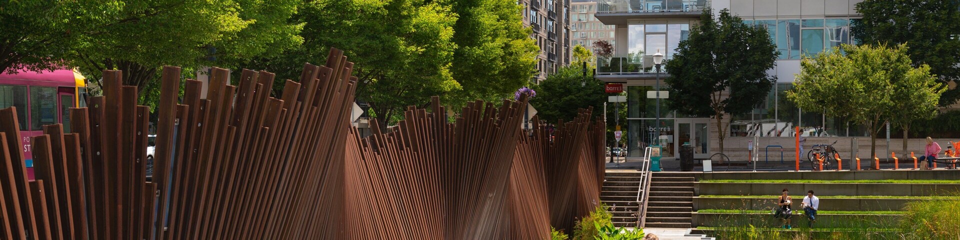 Pearl District showing a pond and a garden as well as an individual femail
