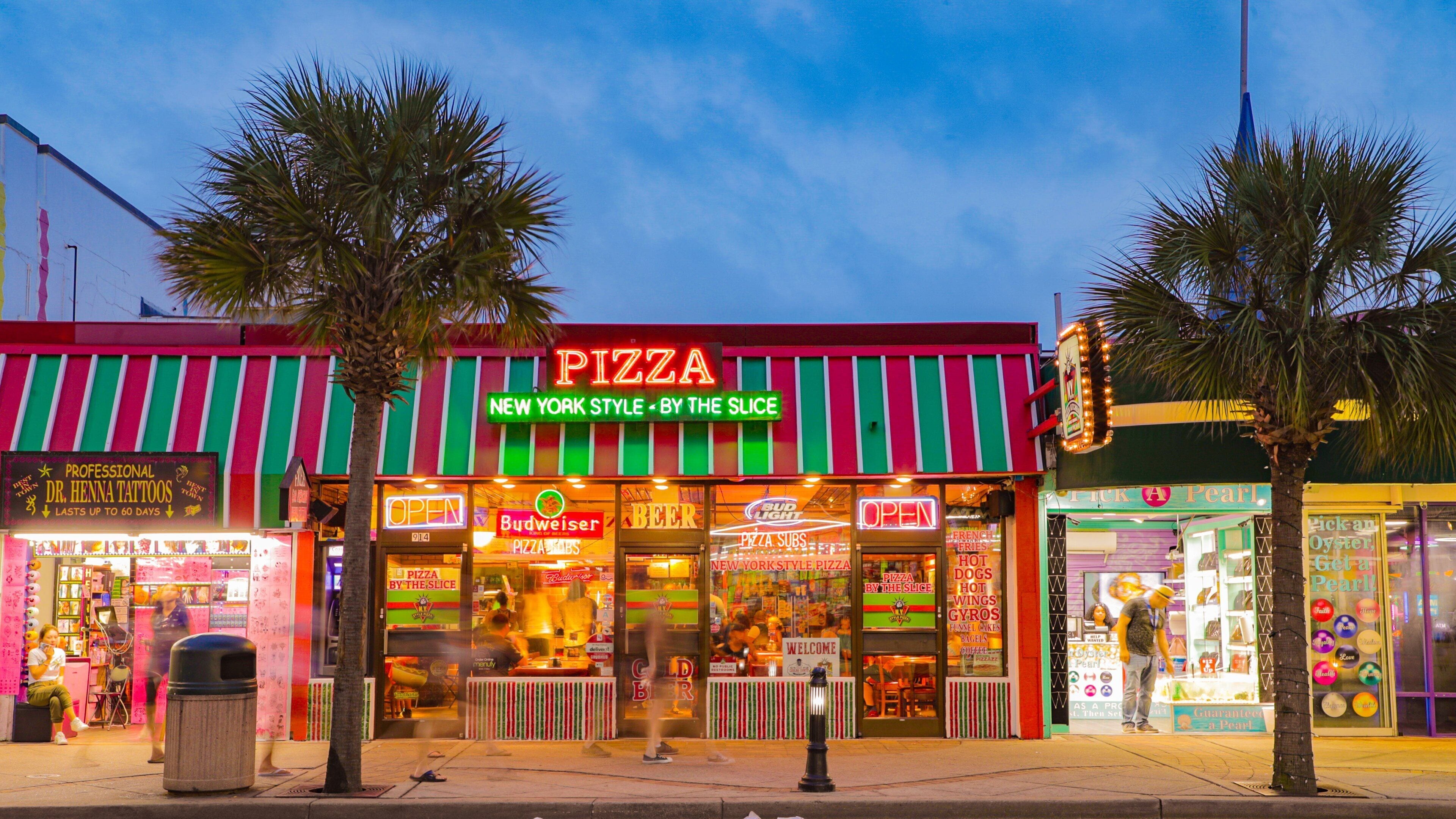 Myrtle Beach Boardwalk which includes signage and night scenes