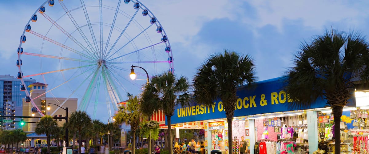 Myrtle Beach Boardwalk featuring night scenes