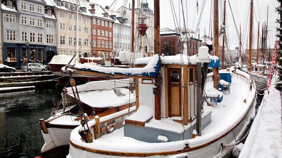 Nyhavn showing boating, snow and a marina