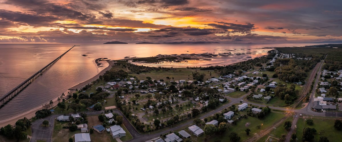 Sunrise view of the famous 6km long sugar cane jetty at Lucinda in Far North Queensland, Australia