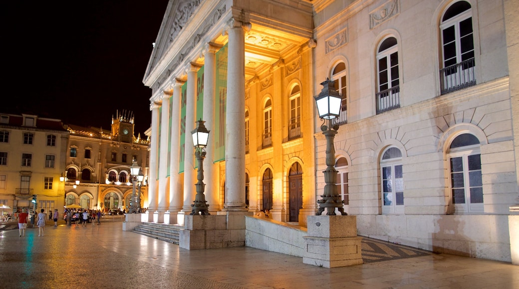 National Theatre of D. Maria II which includes night scenes, heritage architecture and a square or plaza
