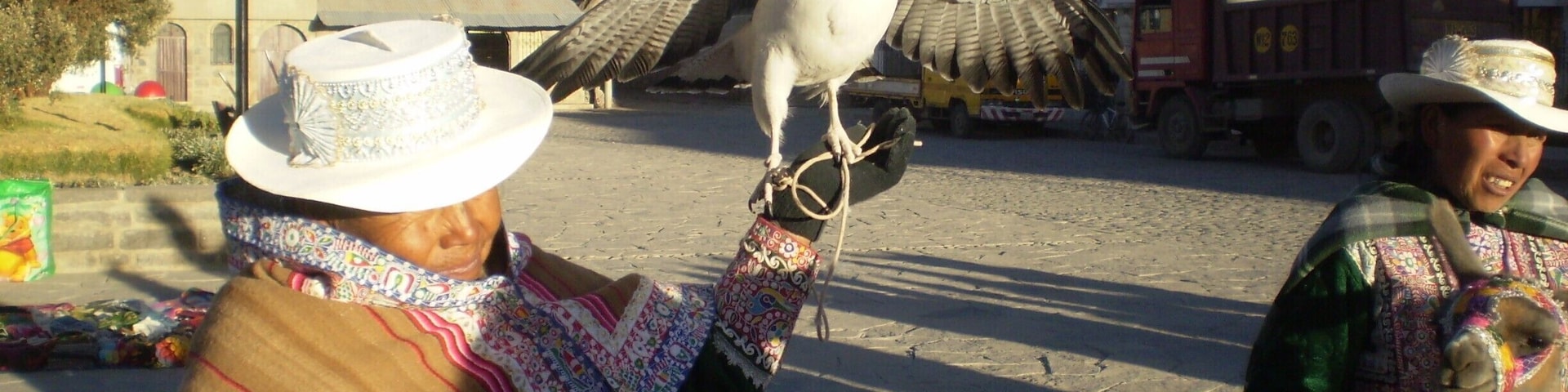 This tiny town, Yanque, is a stop in our way to the Colca Canyon. At the plaza, women brightly dressed exhibit her birds and llamas, and offer to take a photo.