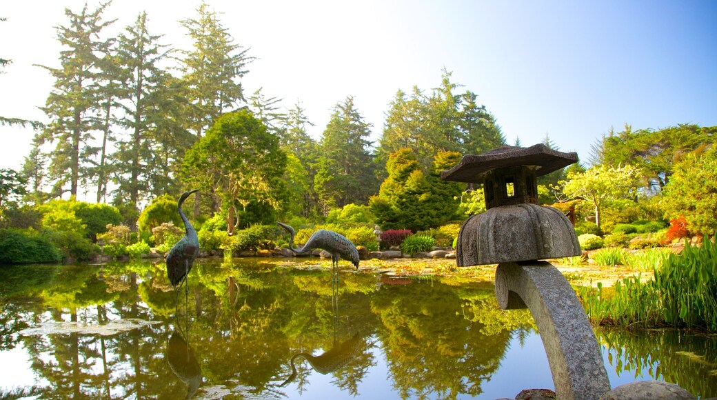 Shore Acres State Park featuring a statue or sculpture and a pond