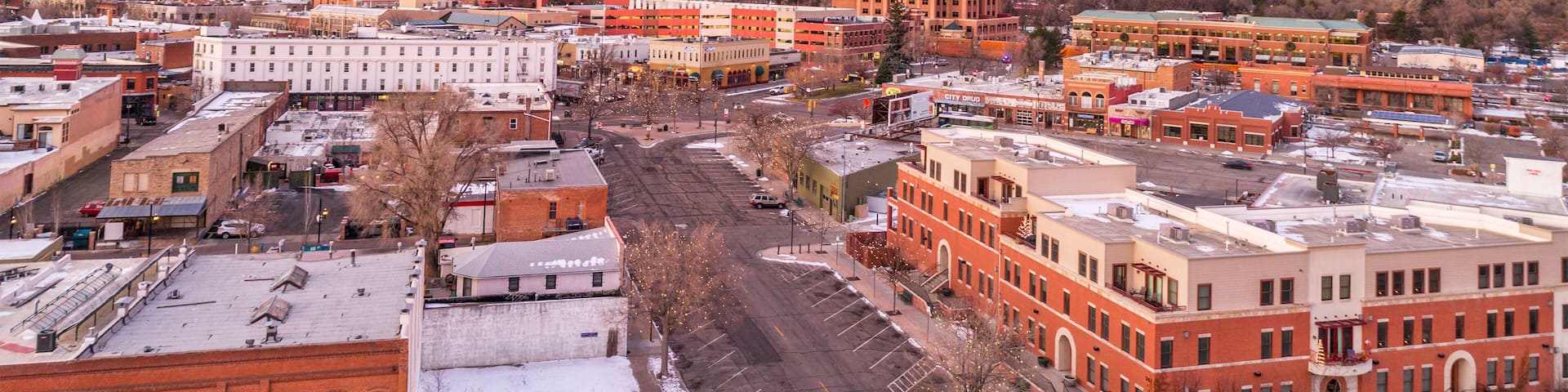 Fort Collins downtown in northern Colorado, aerial view with Rocky Mountains in background