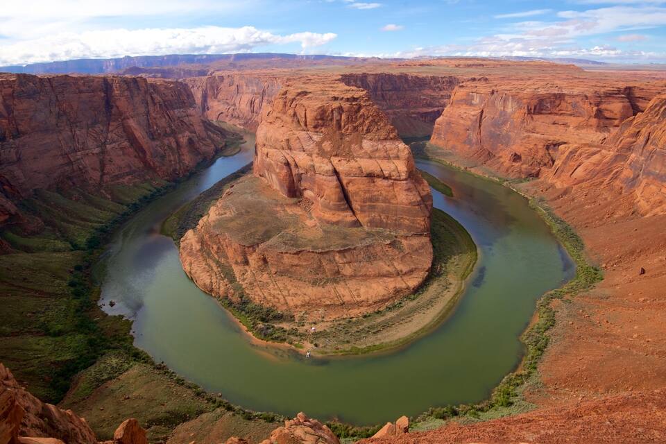 A canyon with a river winding through it.
