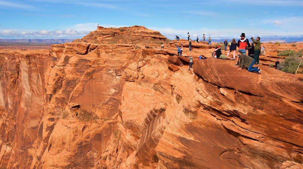 Horseshoe Bend which includes desert views as well as a large group of people