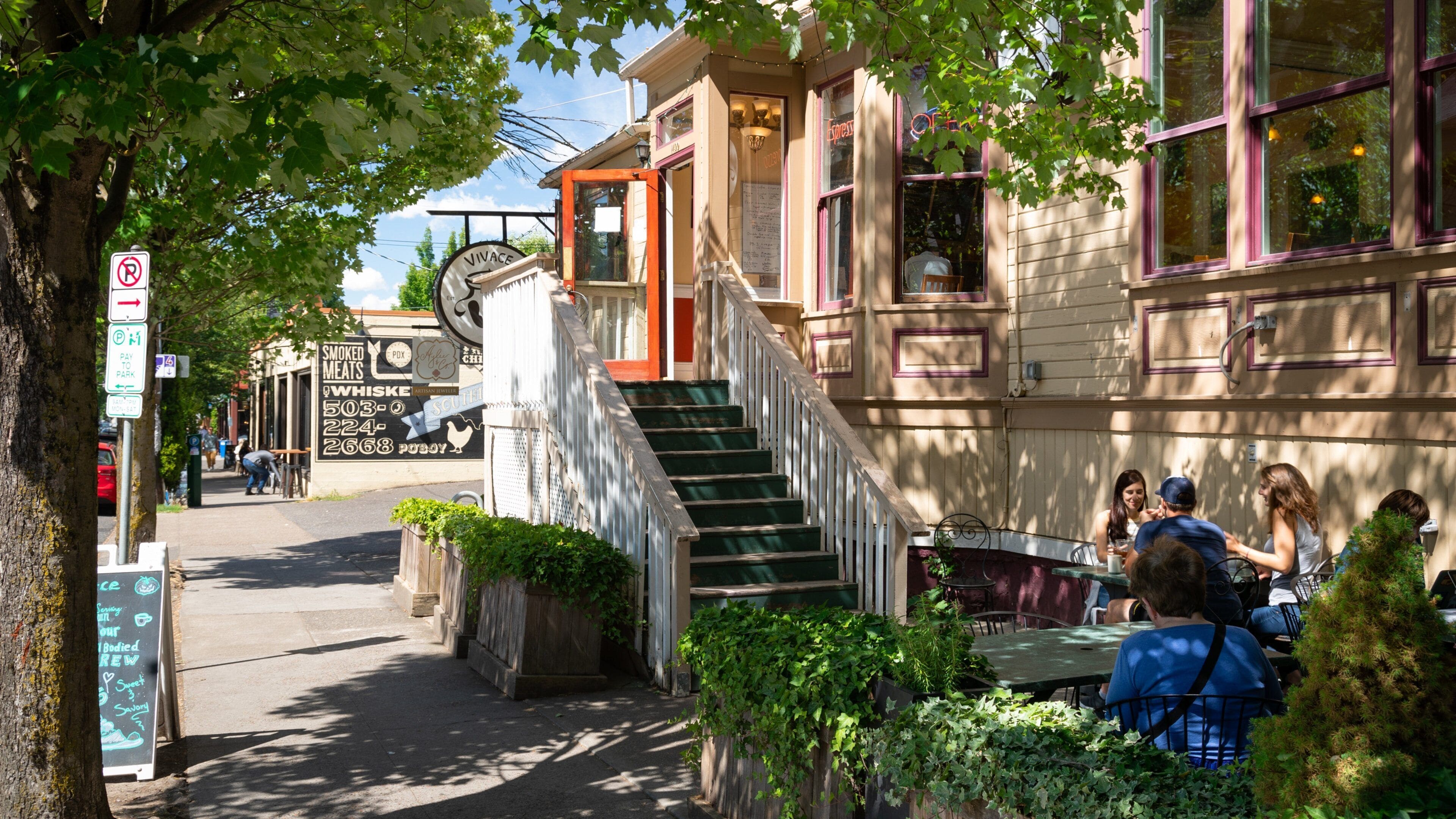 Alphabet Historic District which includes outdoor eating as well as a small group of people