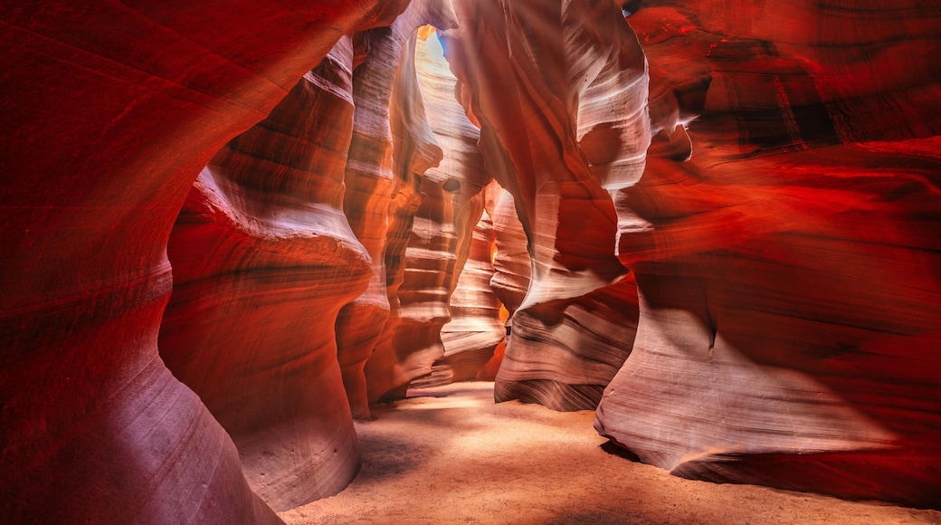 Beautiful wide angle view of sandstone formations in famous Antelope Canyon on a sunny day filtering light rays, Page, American Southwest, Arizona, USA.
