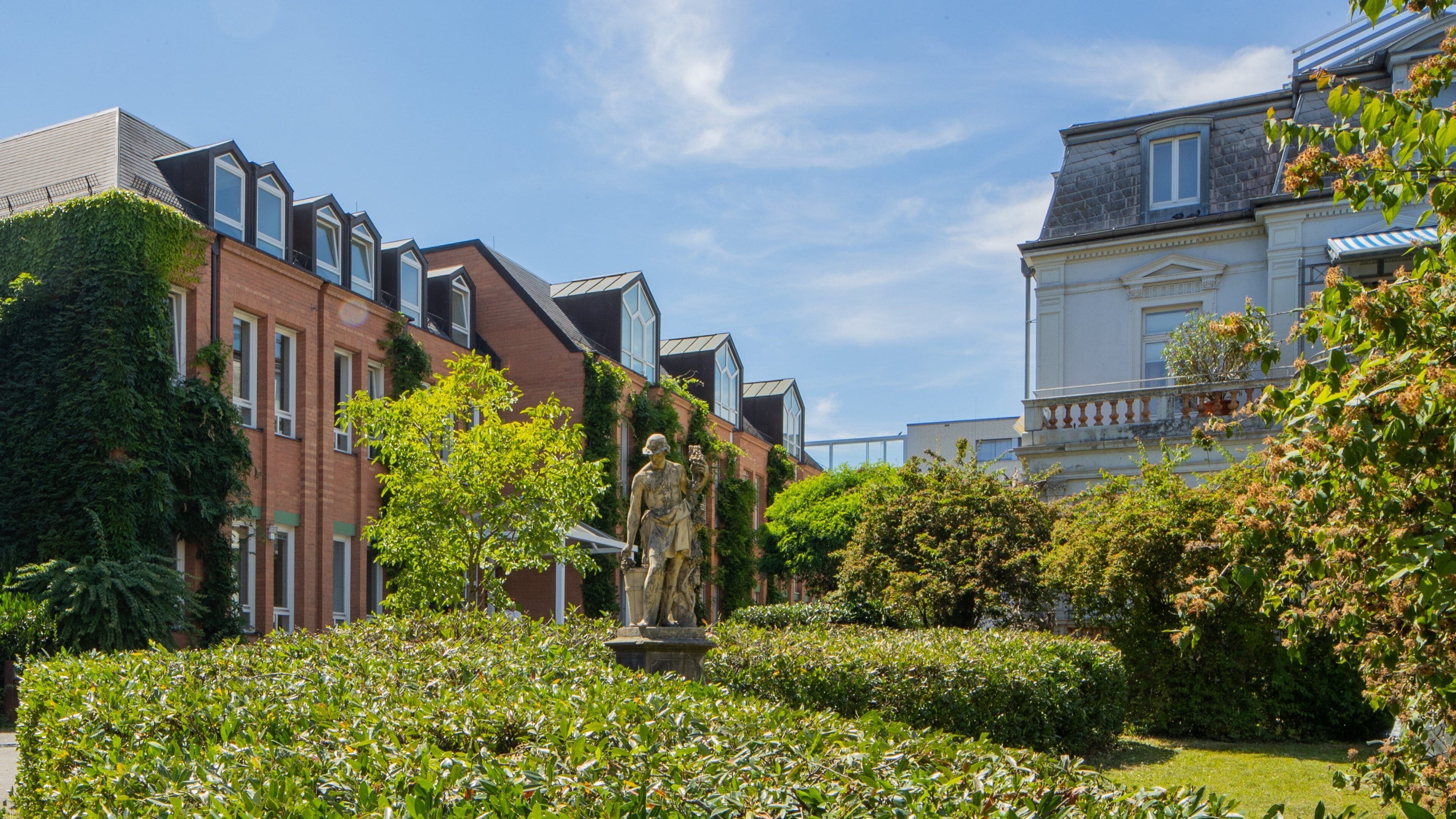 Goethe Institute which includes a garden and a statue or sculpture