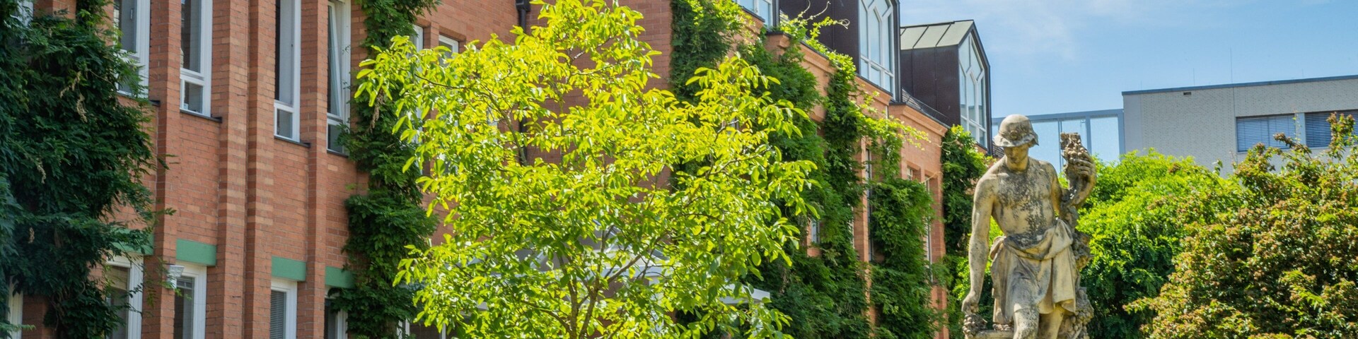 Goethe Institute which includes a garden and a statue or sculpture