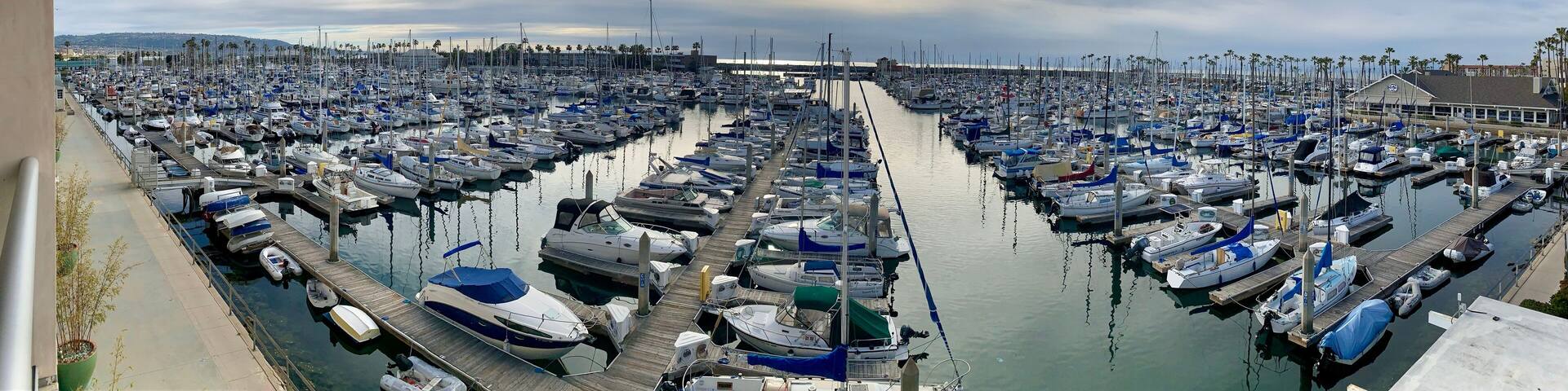 Panoramic view of the marina with yachts and private sailboats in King harbor at Redondo Beach, California