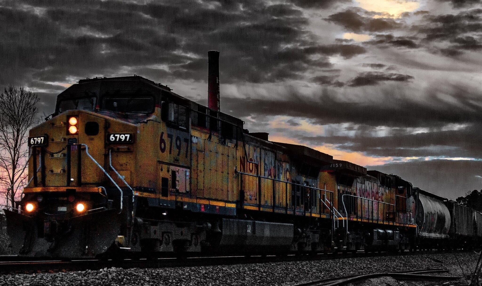 Local train making a night run through town.