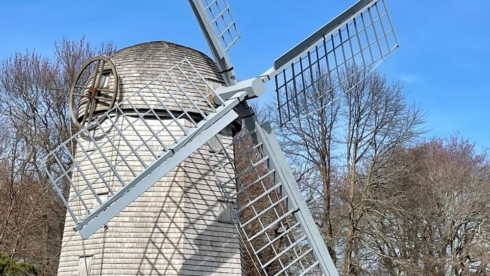 Majestic windmill in a lush green grassy field in Jamestown