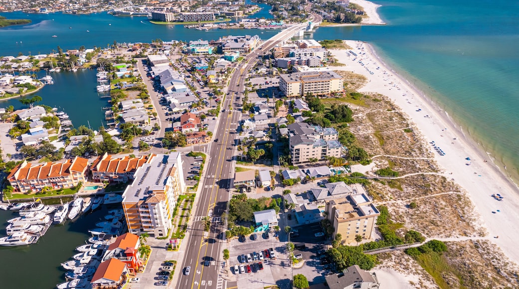 Florida. Madeira Beach Florida. Gulf of Mexico or ocean beach, Hotels and Resorts. John's Pass Village and Boardwalk. Turquoise color of salt water. American shore. Summer or Autumn vacation.