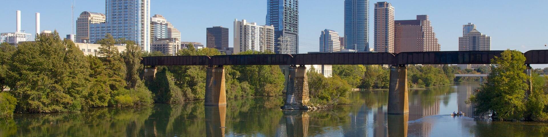 Visit Lady Bird Lake in Austin, Texas, to enjoy nature and city views on a sunny day