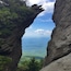 A rock formation with a natural archway.