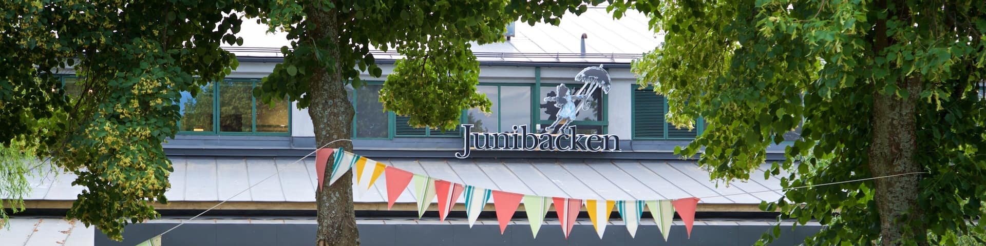 Junibacken which includes a park as well as a small group of people