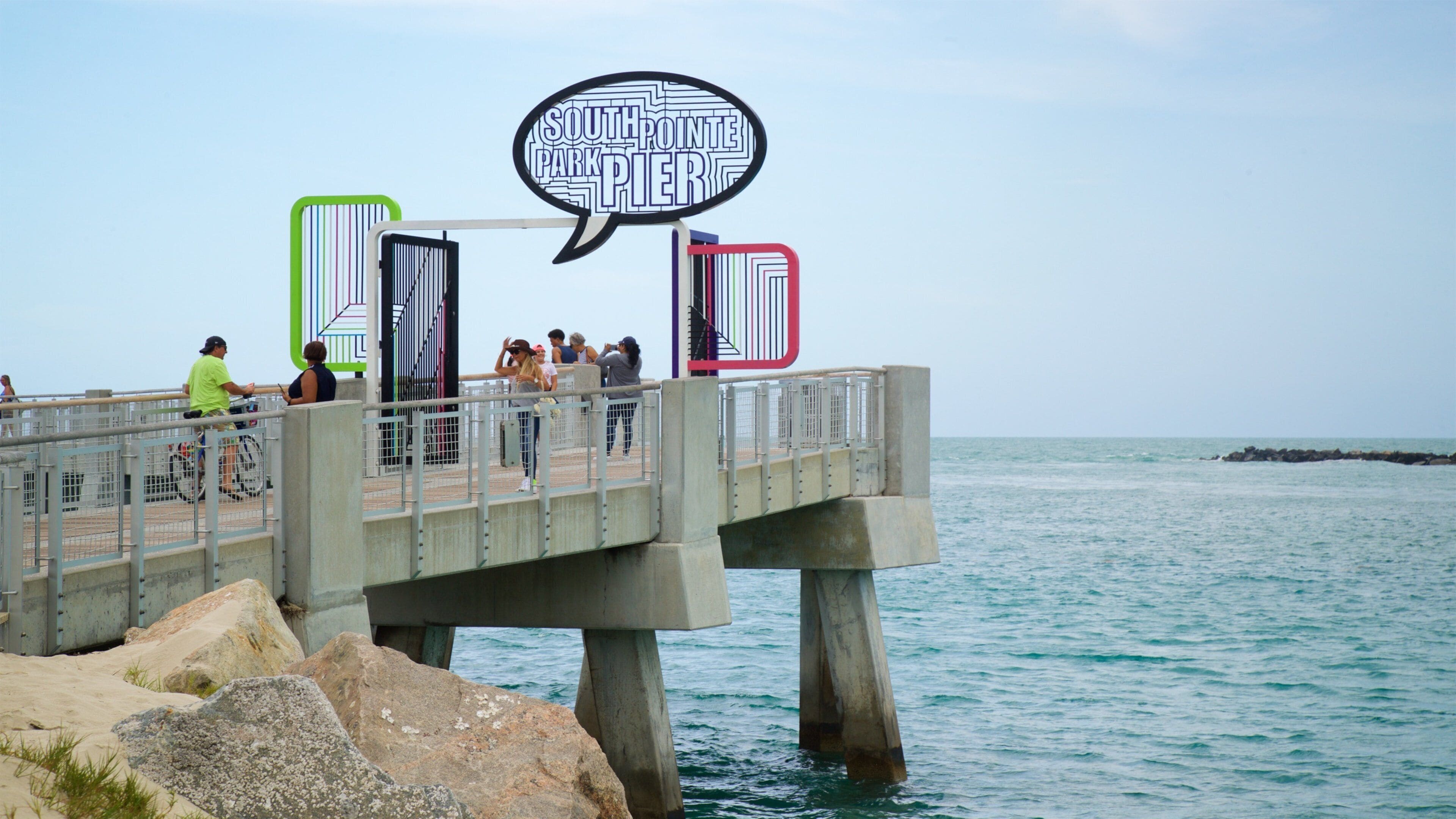 South Pointe Park which includes general coastal views and signage as well as a small group of people