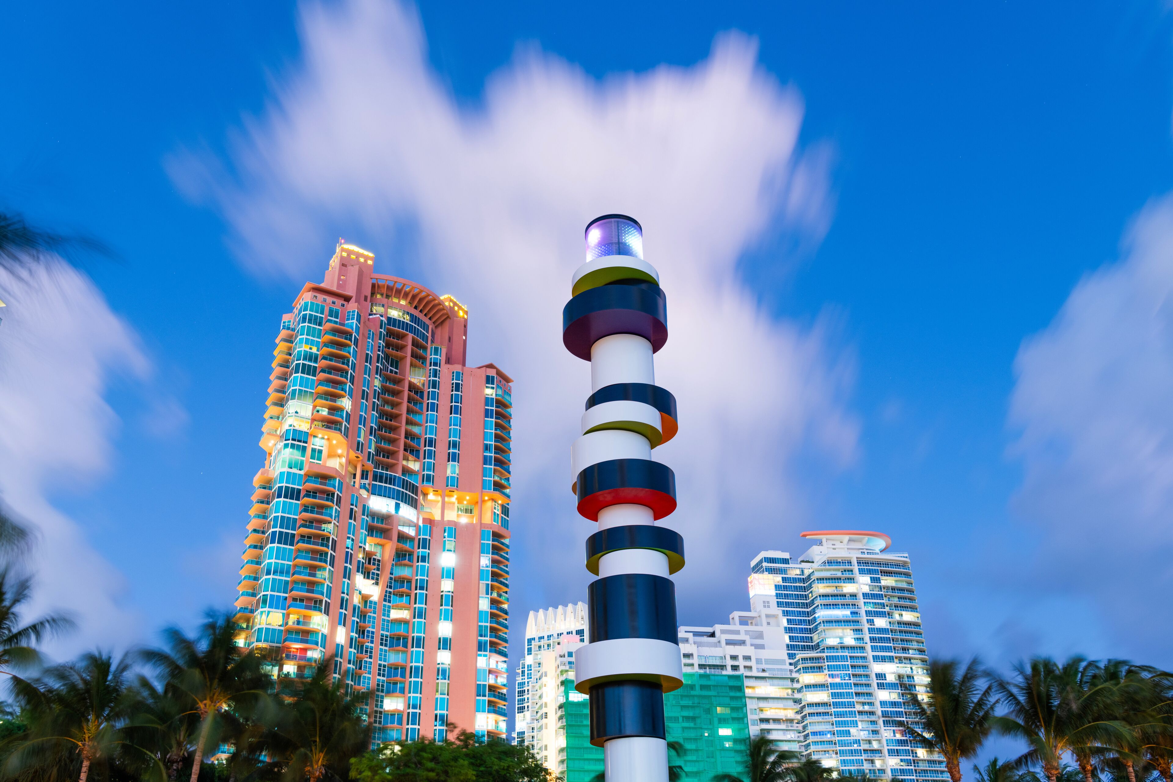 Travel destination. South Pointe Park. Landmark architecture. Lighthouse sculpture. Night city. Urban park in Miami Beach. South beach architecture. Famous monument in South Pointe Park, Florida