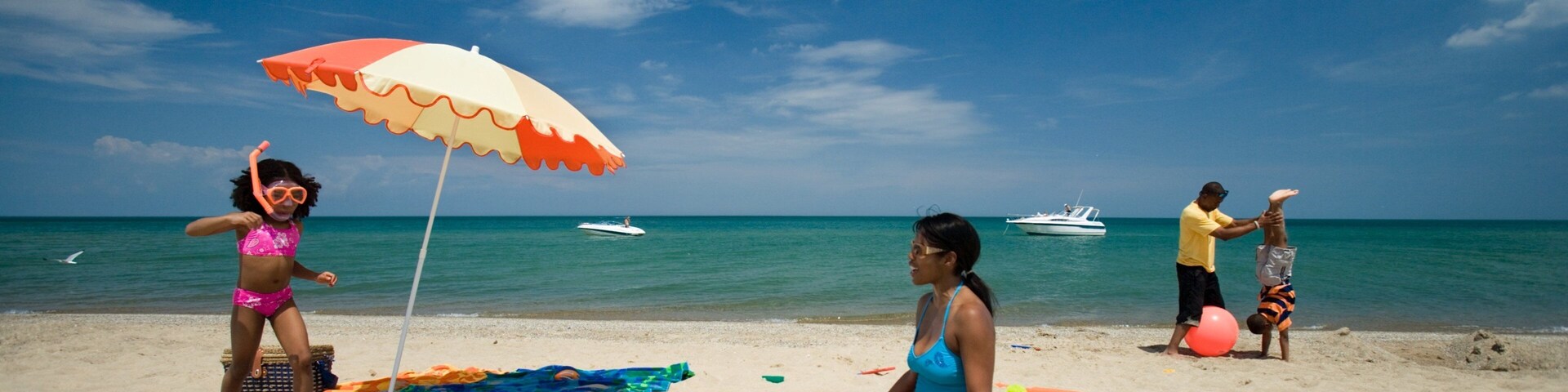 Indiana Dunes State Park which includes a sandy beach and general coastal views as well as a family