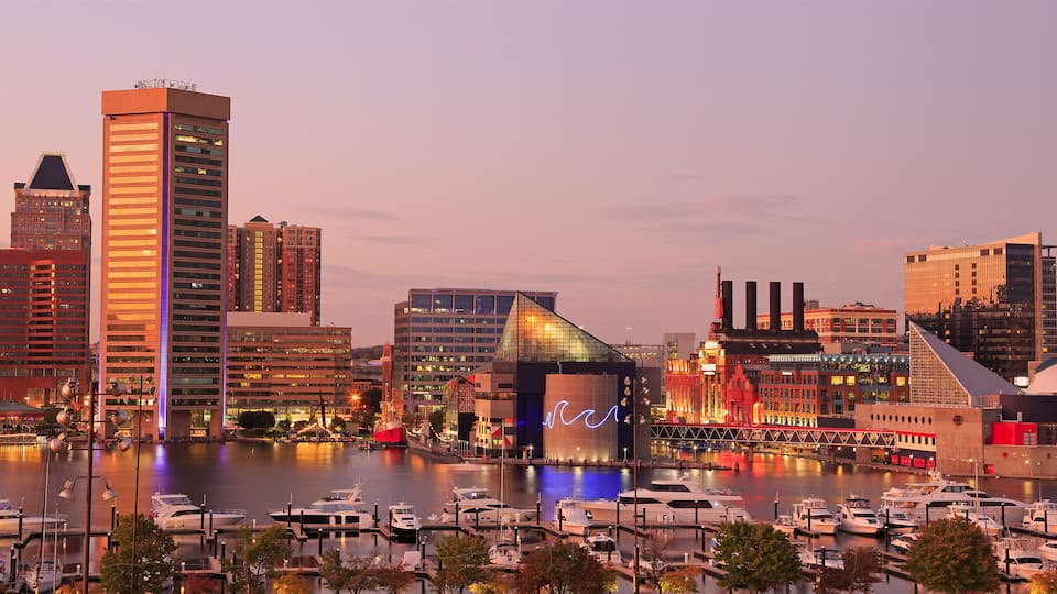 Colorful Baltimore skyline over the Inner Harbor at dusk, USA