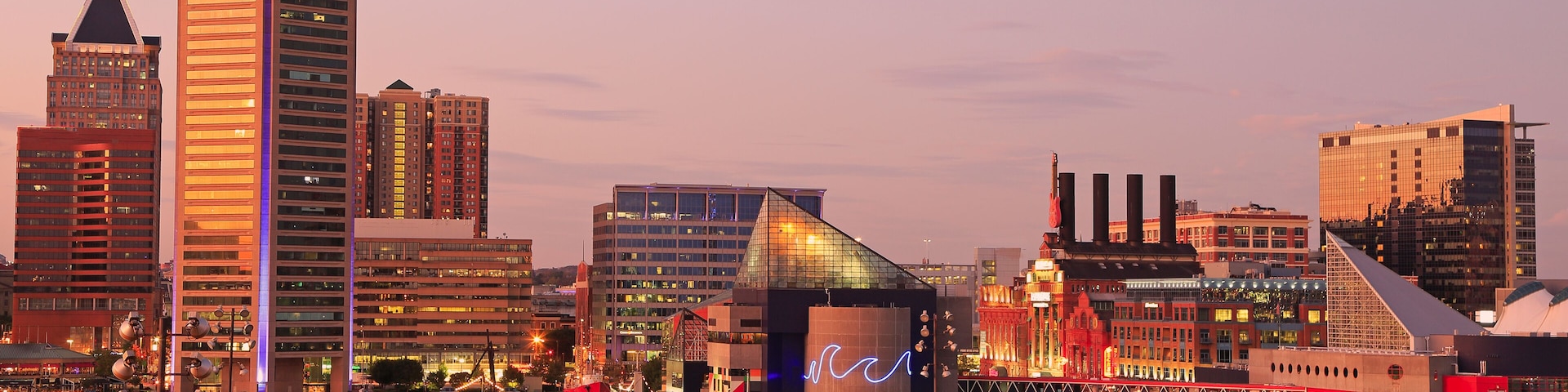 Colorful Baltimore skyline over the Inner Harbor at dusk, USA