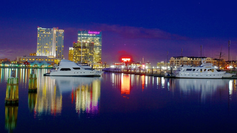 Evening at Baltimore Inner Harbor Marina showcasing yachts and city skyline reflections