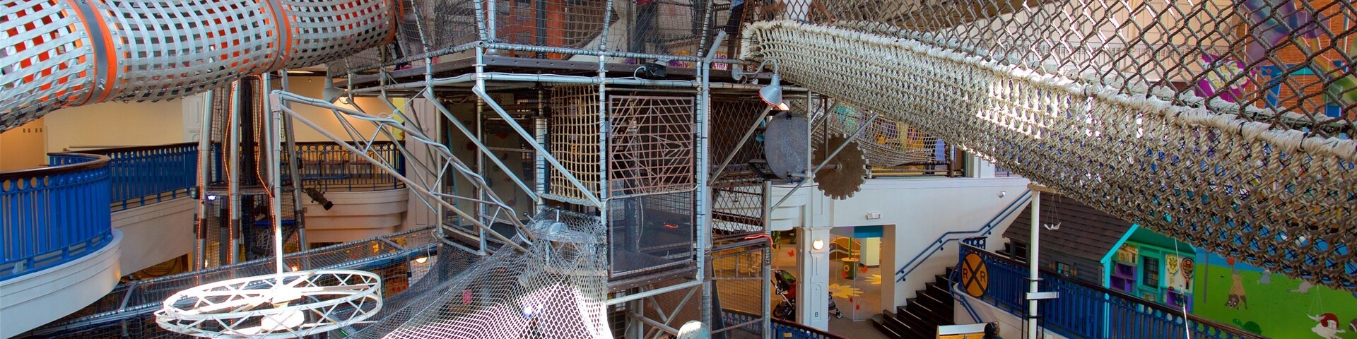 Port Discovery featuring a playground and interior views