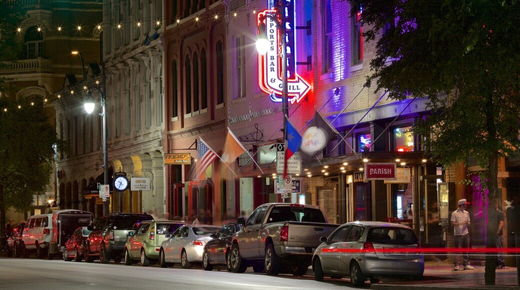 Sixth Street featuring night scenes and a city
