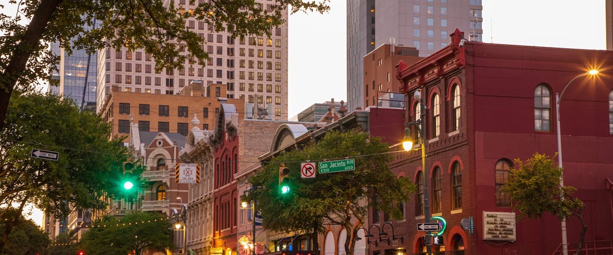 Sixth Street showing a city and a sunset