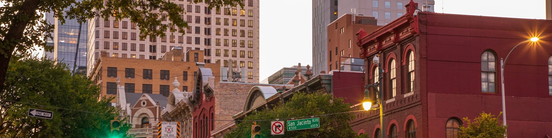 Sixth Street showing a city and a sunset